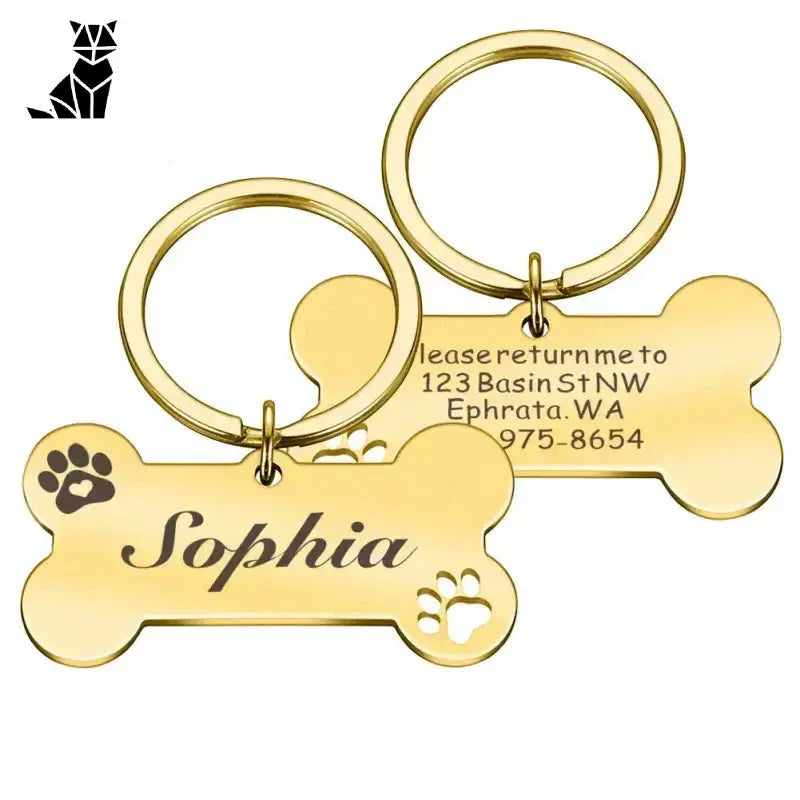 Gros plan sur une médaille gravée en acier brillant pour chien avec porte-clés en os, médaille personnalisée pour animaux de compagnie