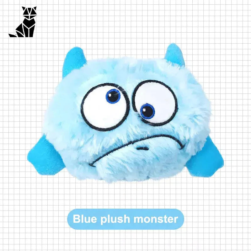 Monstre bleu en peluche avec de grands yeux sur la boule vibrante interactive pour une stimulation ludique